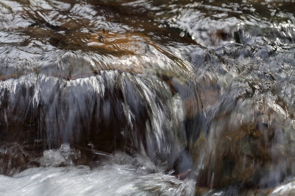 stone under the mountain water, note shallow depth of field - Fotoğraf, Görsel