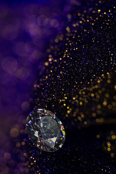 Beautiful big diamond jewelry on dark violet colorful glitter shiny background. Fine natural precious stone.Brillant shine. - Photo, Image