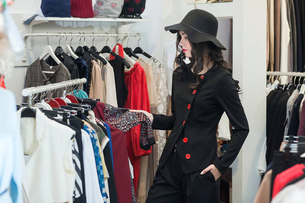 woman in clothing store - 写真・画像