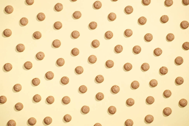Pattern of cookies on a yellow background - Fotó, kép