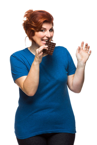 curvy woman eating chocolate - Photo, Image