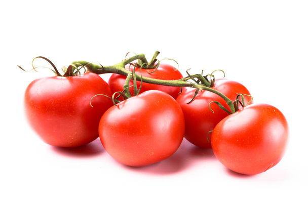 Cinque succosi pomodori rossi lucidi
 - Foto, immagini