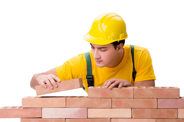 Handsome construction worker building brick wall - Photo, Image
