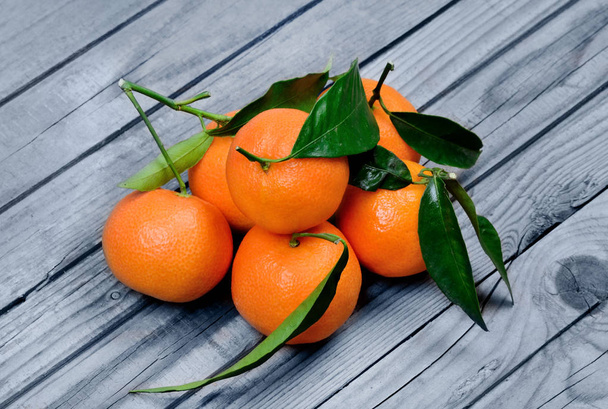 Group of tangerines on table - Φωτογραφία, εικόνα