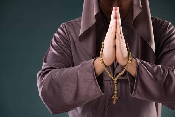 Monk in religious concept on gray background - Fotó, kép