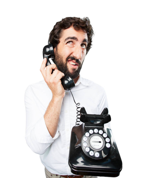 man with vintage telephone and surprise expression - Foto, Bild