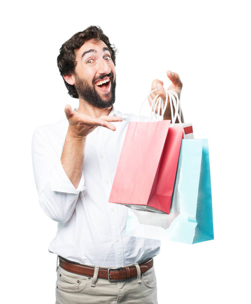 young funny man with shopping bags - Fotó, kép