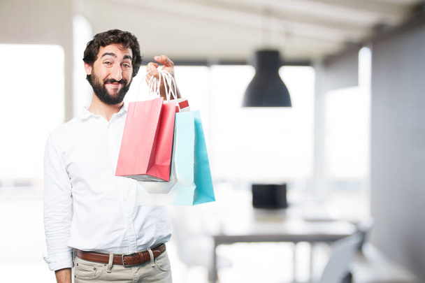 young funny man with shopping bags - Photo, Image