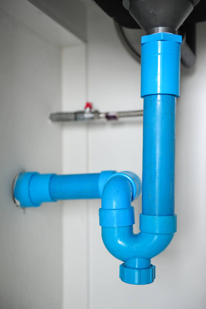sewer pipes under the kitchen sink - Foto, Imagem