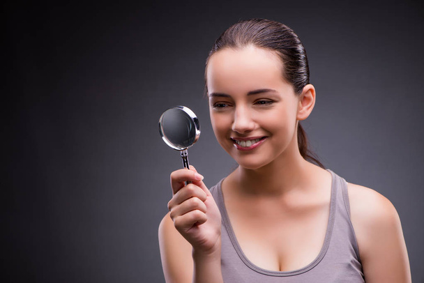 Young girl with magnifying glass - Photo, Image