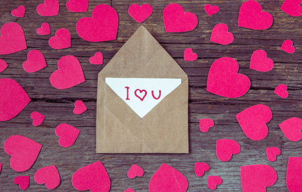 Envelope with card and text I love you and red hearts for valent - Photo, Image