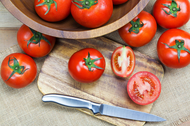 Closeup Fresh ripe tomatoes on wood background - Foto, afbeelding