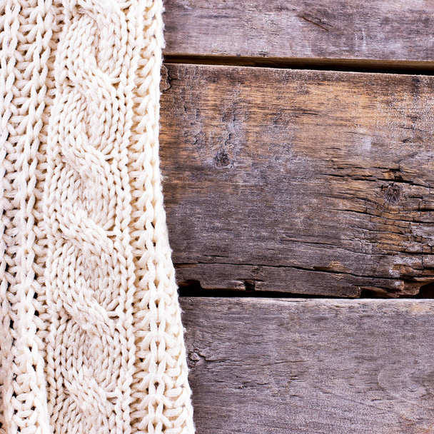 knitted plaid, sweater on old wooden boards - Foto, Bild