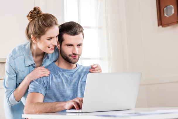 Couple using laptop - Photo, Image