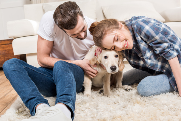 Young couple with puppy - Photo, Image