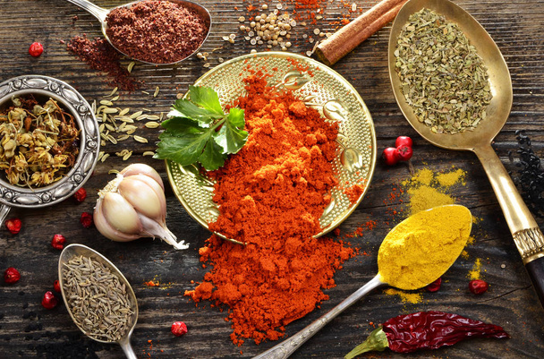 Spices mix on a wooden background - Foto, afbeelding