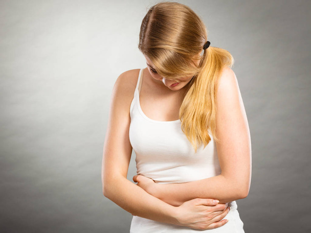 Woman suffer from belly pain. - Foto, Bild
