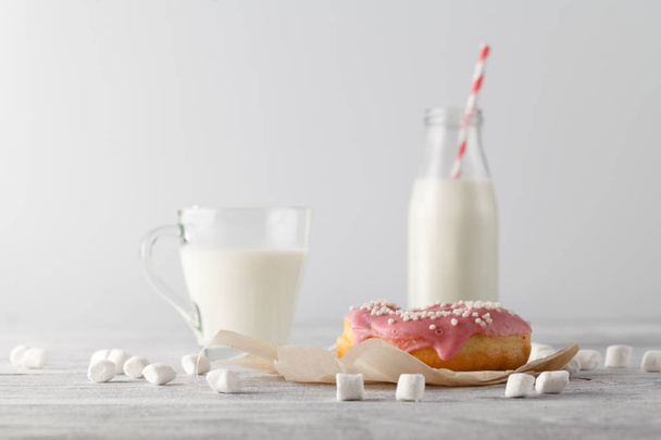 Pink donuts with milk - Photo, image