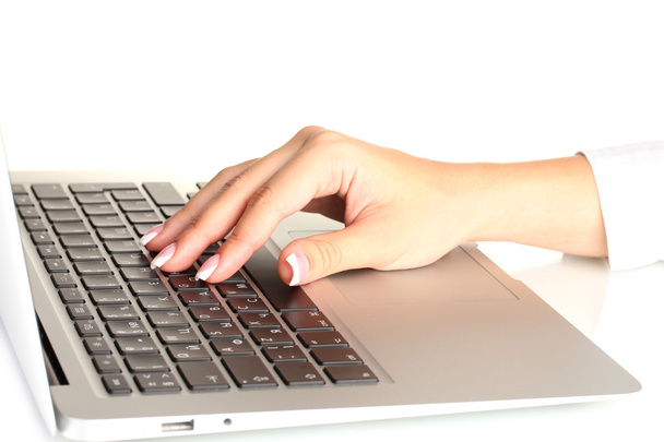 business woman's hands typing on laptop computer, on white background close - Fotó, kép