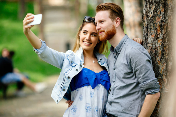 Couple taking selfie - Фото, изображение