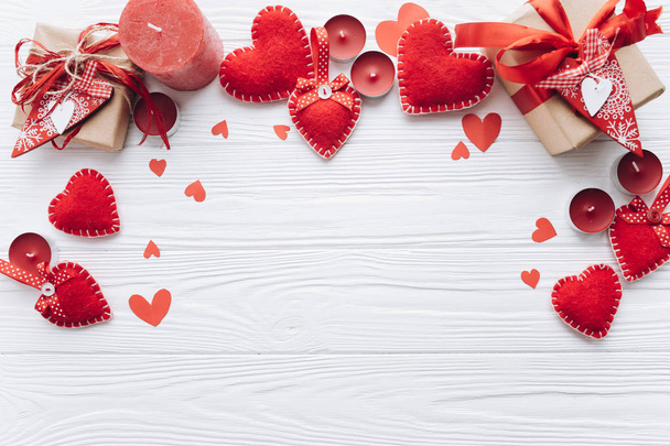 Red hearts and gifts on wooden background - Photo, Image