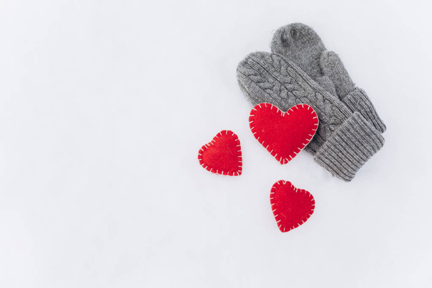 Mittens and hearts on snow  - Photo, Image
