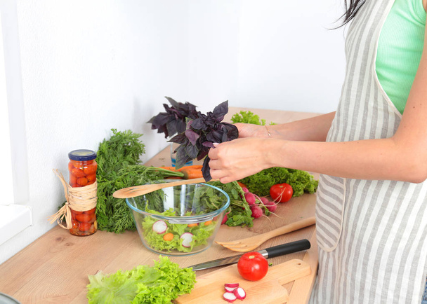 Fresh vegetables on the cutting board are falling in the pot, concept of cooking - Foto, Imagen