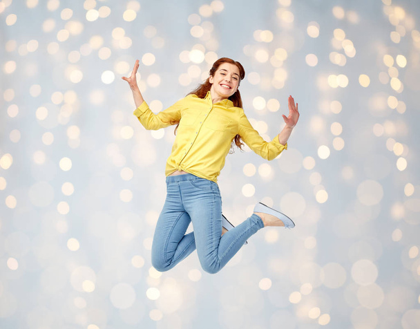 smiling young woman jumping in air - Photo, Image
