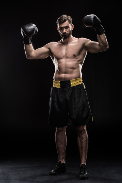 Sportman in bokshandschoenen - Foto, afbeelding