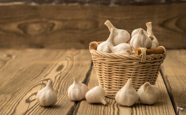 Basket with garlic  - Photo, image