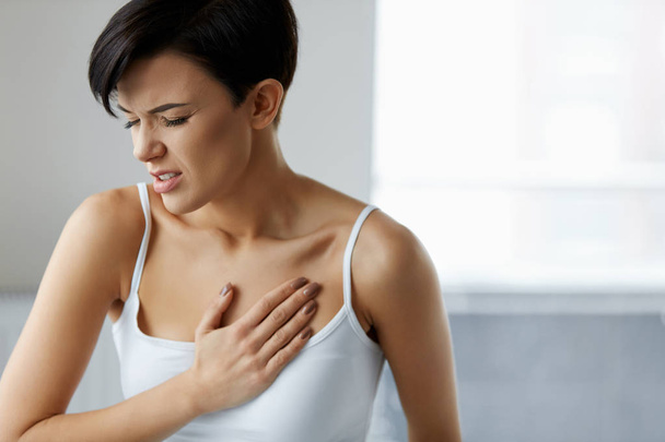 Heart Attack. Beautiful Woman Feeling Pain In Chest. Health Care - Valokuva, kuva