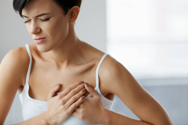 Heart Attack. Beautiful Woman Feeling Pain In Chest. Health Care - Foto, imagen