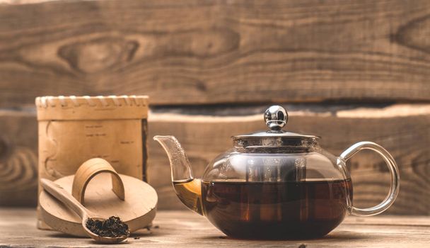 hot herbal tea in a transparent teapot  - Foto, Bild