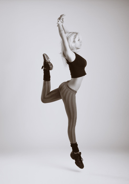 Modern ballet dancer dancing on the white studio background - Фото, изображение