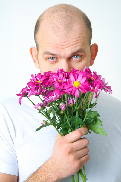 Człowiek z kwiatami - Zdjęcie, obraz