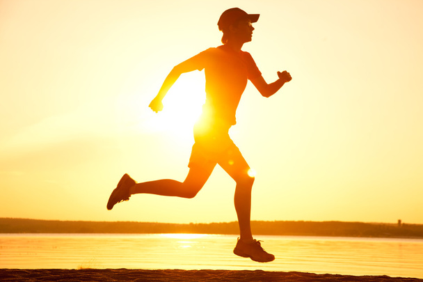 runner at sunset - Фото, зображення