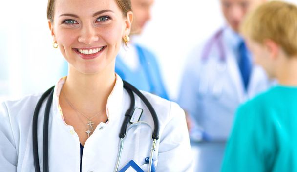 Woman doctor standing with stethoscope at hospital - Фото, изображение