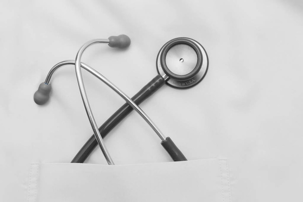 stethoscope in the doctor's uniform pocket - Photo, image
