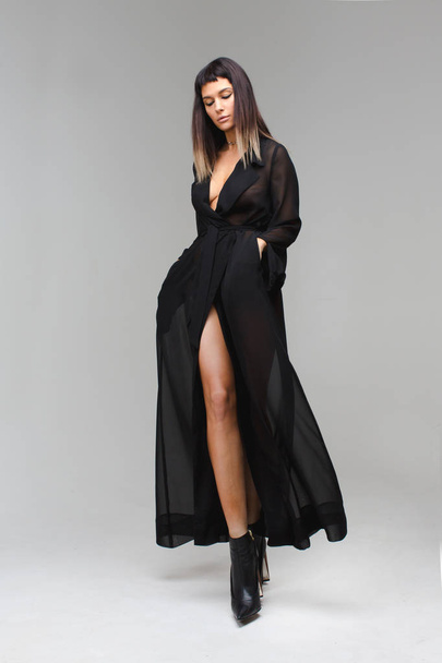 Woman in black transparent nightie underwear - 写真・画像