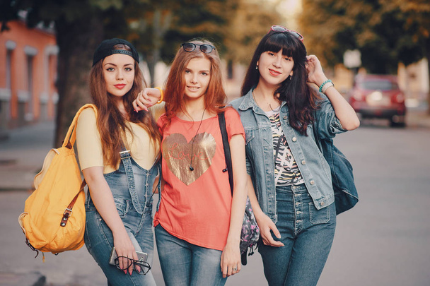 three young girls walking in the park - Foto, Bild