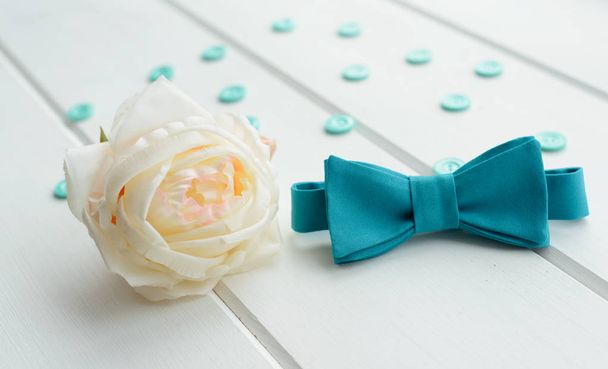 white rose and a tie on a white background - Photo, image