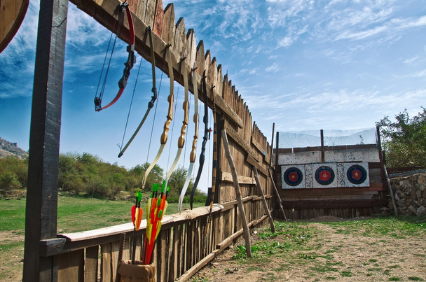 shooting bows on a wooden wall - Photo, Image