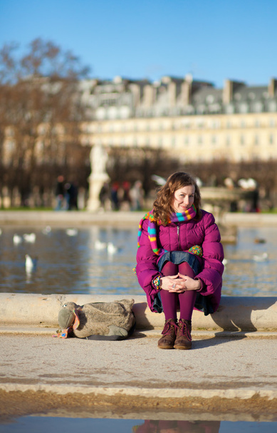 Pretty young girl in bright clothes in the Tuilleries garden in - Zdjęcie, obraz