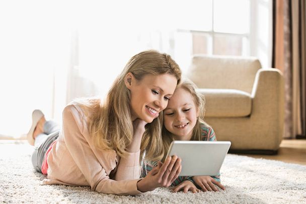 Mother and daughter using digital tablet  - Foto, Imagem