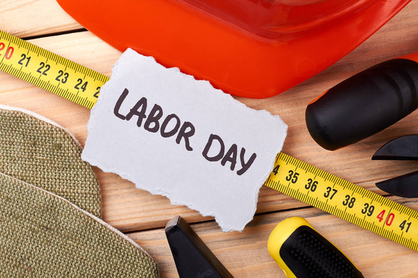 Labour Day card among instruments. - Photo, Image