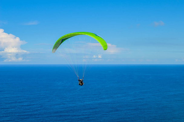 Paragliding above ocean - Photo, Image