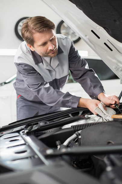 mechanic repairing car engine  - 写真・画像