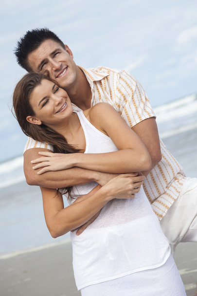 Man and Woman Couple Embracing On A Beach - Fotó, kép