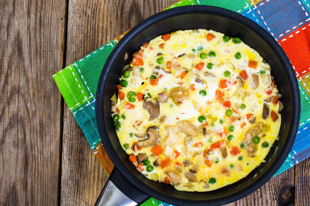 Omelet with vegetables in a pan - Photo, Image