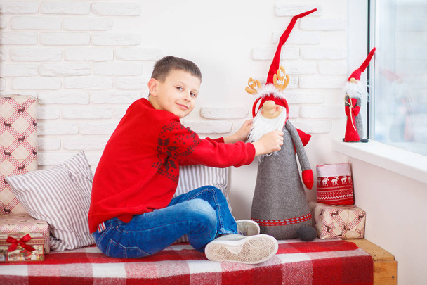 boy in a red sweater christmas tree new year - Photo, Image